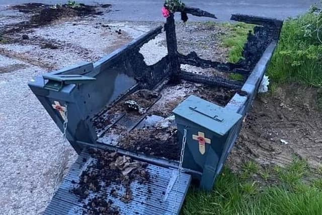 The remains of the floral tribute landing craft from the Stewartstown war memorial. Coalisland Royal British Legion image