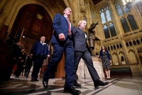 Prime Minister Boris Johnson (right) with the leader of the Labour Party Keir Starmer walk towards the House of Lords in Westminster ahead of the State Opening of Parliament. The Prince of Wales read the Queen's Speech as the Queen missed the State Opening of Parliament for the first time in almost 60 years. Photo: Toby Melville/PA Wire