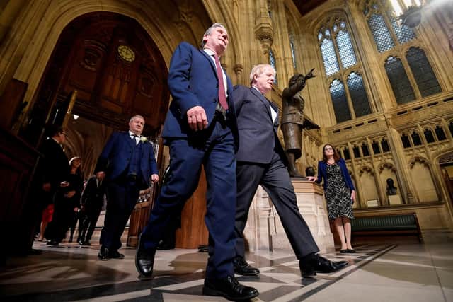 Prime Minister Boris Johnson (right) with the leader of the Labour Party Keir Starmer walk towards the House of Lords in Westminster ahead of the State Opening of Parliament. The Prince of Wales read the Queen's Speech as the Queen missed the State Opening of Parliament for the first time in almost 60 years. Photo: Toby Melville/PA Wire
