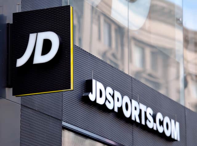 File photo dated 06/01/16 of a shop sign for JD Sports in central London, as JD Sports has lifted its profit forecasts again on the back of strong sales despite shortages of key footwear lines. The retailer saw shares lift higher after it said it was "reassured" by trading over the 14 weeks to May 7. Issue date: Thursday May 12, 2022. It reported like-for-like sales for the period had been more than 5% higher than the same period last year.