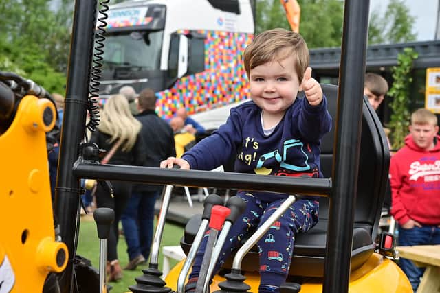 Two-year-old Daithi McGeough from Portadown is busy at work at the Balmoral show.
 Picture By: Arthur Allison/Pacemaker Press.