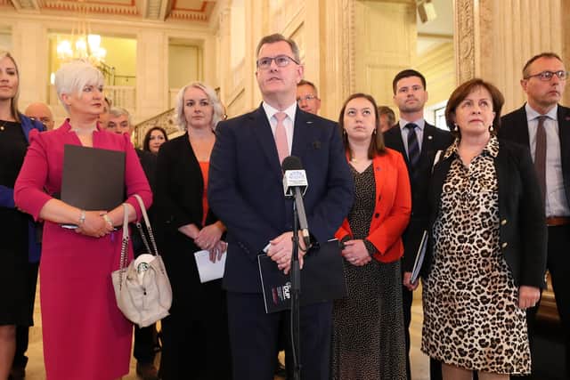 DUP leader Sir Jeffrey Donaldson, flanked by his Assembly team, giving a press conference in the Great Hall at Stormont yesterday