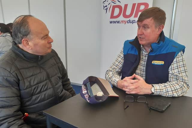 Trevor Boyd from Ballymena is among the wellwishers saying hello to Mervyn Storey at the DUP tent at the Balmoral Show yesterday, one week after the former North Antrim MLA lost his seat. Picture by Ben Lowry