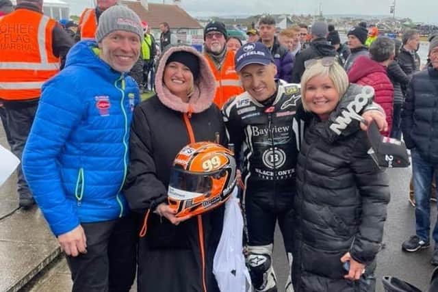 Jeremy McWilliams with Rachel Burrows (right), team owner John Burrows and Jill McWilliams after the Glengormley man's podium finish in the Supersport race on Thursday night at the North West 200.