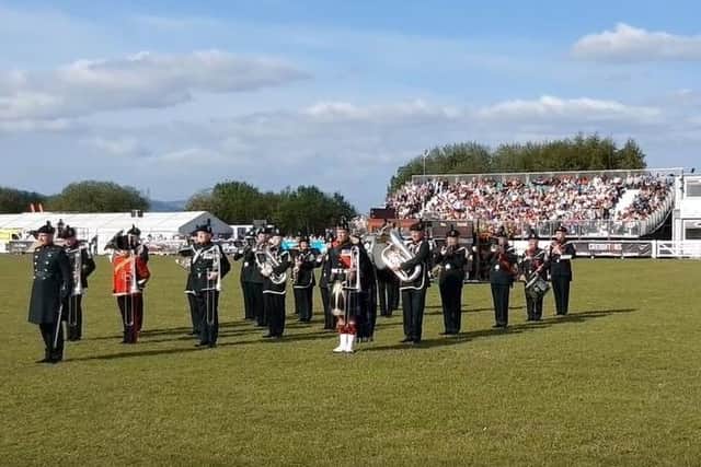 A Band, Bugles, Pipes & Drums of the Royal Irish Regiment play their regimental quick march Killaloe after the band's performance in the main arena on the last day of the Balmoral Show 2022, bringing the event to a close