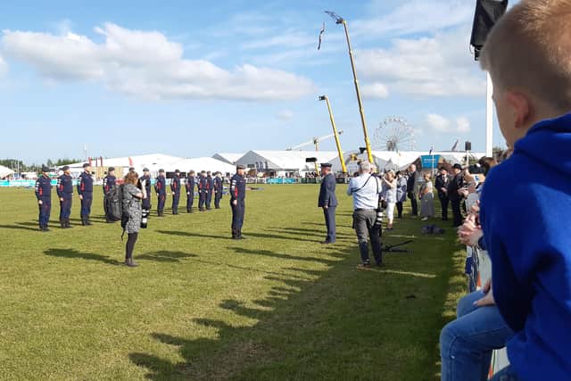 The RAF Falcons Parachute Display Team saluting Air Marshal Sean Reynolds in the main arena which they had just landed in after a 7,000 foot jump which brought the four day Balmoral Show to a close