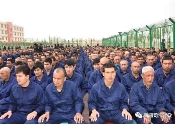 Uyghur Muslim detainees in a Chinese concentration camp in western China, circa 2017; image from Human Rights Watch