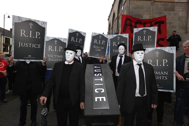 Protesters from Relatives For Justice outside Hillsborough Castle during a visit by Prime Minister Boris Johnson to Northern Ireland