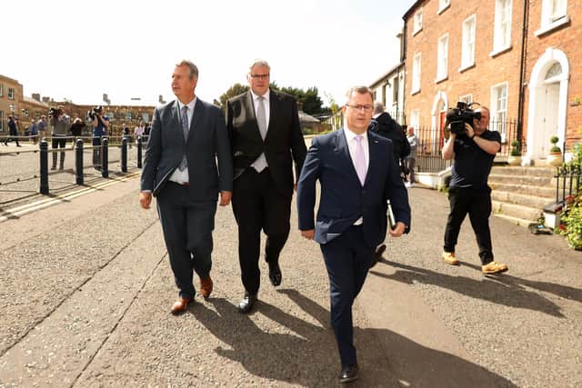 DUP leader Sir Jeffrey Donaldson (right), leaves Hillsborough Castle with his colleagues Gavin Robinson MP (centre), and Edwin Poots MLA(left), after speaking to the media following their meeting with Prime Minister Boris Johnson at Hillsborough Castle
