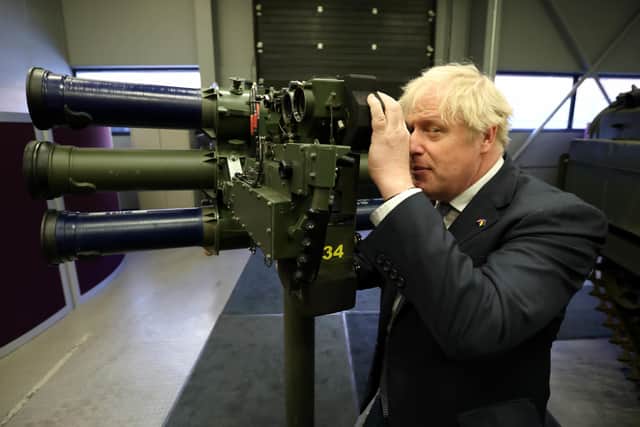 Prime Minister Boris Johnson with a Mark 3 shoulder launch LML (Lightweight Multiple Launcher) missile system, at Thales weapons manufacturer in Belfast, during his visit to Northern Ireland for talks with Stormont parties. Picture : Liam McBurney/PA Wire