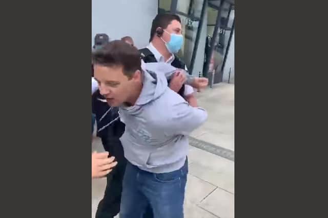 Gospel preacher Ryan Williamson, 44, is arrested by PSNI officers for suspected disorderly behaviour after refusing to stop preaching in Larne town centre on Tuesday. He was dearrested 30 minutes later and went back to preaching.