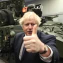 Prime Minister Boris Johnson with a Mark 3 shoulder launch LML (Lightweight Multiple Launcher) missile system, at Thales weapons manufacturer in Belfast, during his visit to Northern Ireland for talks with Stormont parties