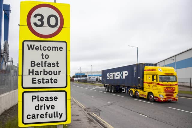 Haulage lorry drives passed a sign at Belfast Port