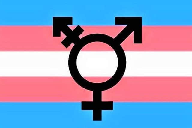 One of the symbols for transgenderism, set against the backdrop of the international transgender flag; transgender is just one of several classes of identity which the PSNI has pledged itself to 'celebrating'
