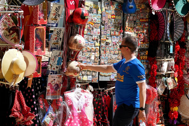 Rangers fan looks at the local merchandise in the Plaza de Espana before the UEFA Europa League Final at the Estadio Ramon Sanchez-Pizjuan, Seville.