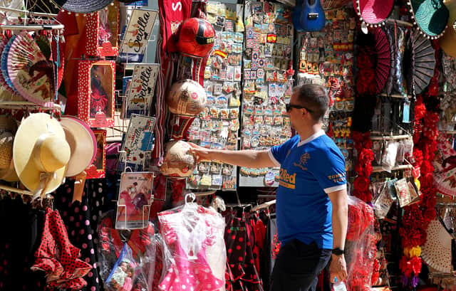 Rangers fan looks at the local merchandise in the Plaza de Espana before the UEFA Europa League Final at the Estadio Ramon Sanchez-Pizjuan, Seville.