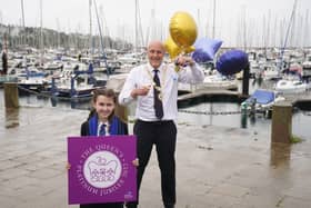 Mayor of Ards and North Down, Mark Brooks,
and Melissa Doherty, 12, a pupil at Glenlola Collegiate Girls School, at Bangor Marina celebrating the announcement that Bangor has been awarded city status to mark the Queen's Platinum Jubilee