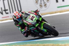 Jonathan Rea finished on the rostrum in third in the opening race of the weekend at Estoril in Portugal on Saturday.