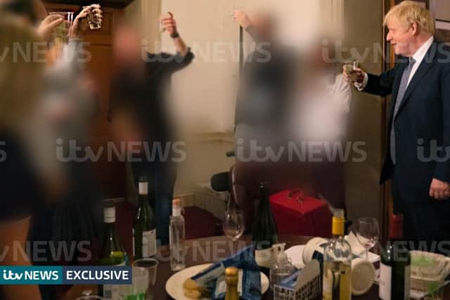 A photograph obtained by ITV News of the Prime Minister raising a glass at a leaving party on 13th November 2020