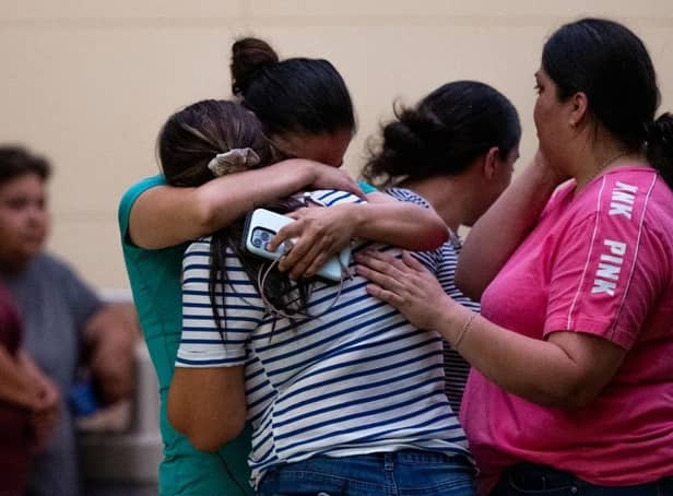 People mourn outside of the SSGT Willie de Leon Civic Center following the mass shooting at Robb Elementary School on May 24, 2022 in Uvalde, Texas.