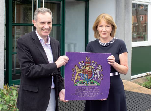 Nick Coburn CBE, group managing director and Joyce McIvor, Contract sales director for UK and Ireland, mark the news that Ulster Carpets have been granted a Royal Warrant by Her Majesty the Queen