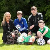 Pictured launching the ‘Eat Well, Play Well’ campaign is Northern Ireland senior women's international, Kirsty McGuinness and Northern Ireland U19 international, Michael Forbes alongside Nicola Finlay, Regional Manager for M&S in Northern Ireland and budding young footballer, Theo Lever.