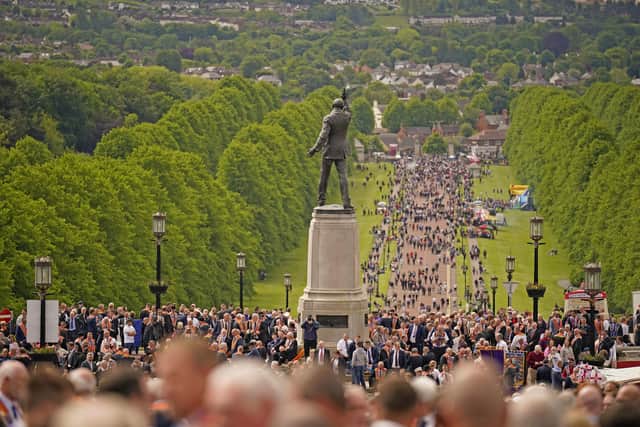 People gather at Stormont before the start of the Northern Ireland centenary parade from Stormont towards City Hall in Belfast, to commemorate the creation of Northern Ireland on Saturday May 28, 2022. Photo: Niall Carson/PA Wire