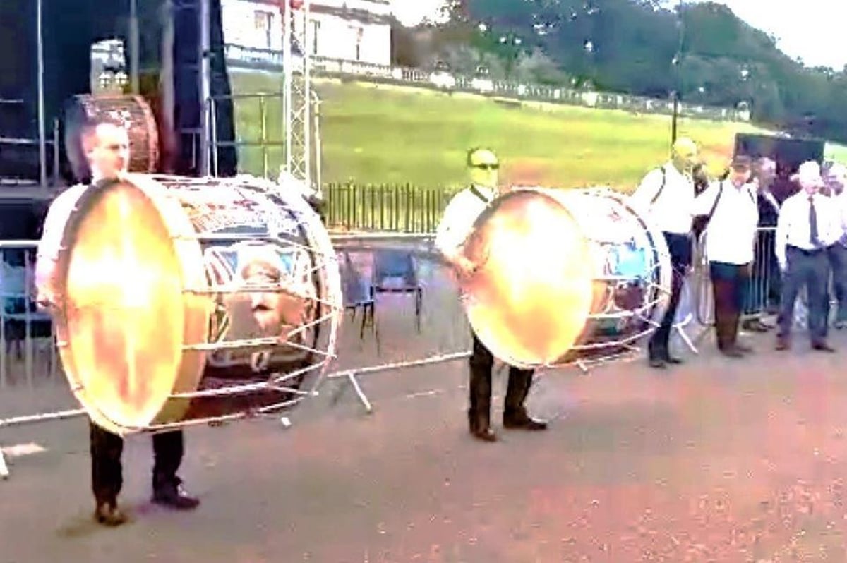 NI Centenary Parade: Crack and whistle of drums and flutes begins to waft over assembly ground