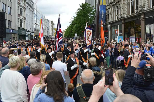 The Grand Lodge colour party and the Kellswater Flute Band led the NI Centennial parade of 25,000 into Belfast city centre on Saturday. 
Picture: Arthur Allison/Pacemaker Press.