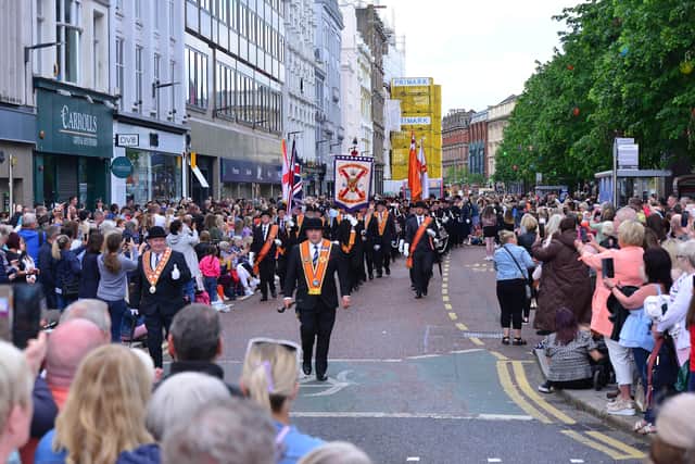 The parade on Donegall Place approaching Belfast City Hall on Saturday. Photo Arthur Allison/Pacemaker Press