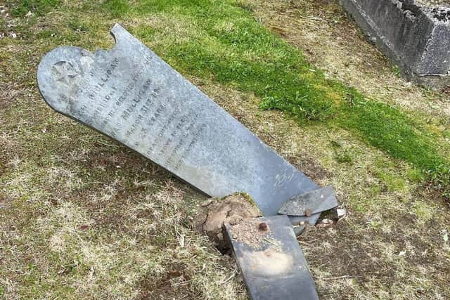 The vandalised headstone at a church graveyard on the Lurgan Road, Banbridge