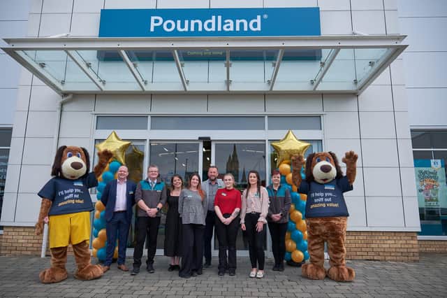 The Poundland team on the opening day with one of the first customers receiving their goodie bag