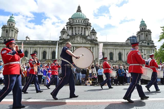 Part of the Northern Ireland centenary parade arrives in Belfast City Hall on Saturday. There was no trouble during the long procession but had there been any it would have put the parade in disgrace and received widespread coverage - more than the three minutes of coverage given to the massive parade itself.
Picture by Arthur Allison/Pacemaker Press