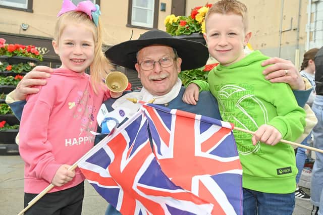 One of Thursday's jubilee events in Sammy Wilson's East Antrim constituency. Pictured with Carrick Town Crier Godfrey Robinson are Katie and Alex Trueick.A programme of free entertainment for all the family is taking place in Mid and East Antrim throughout the weekend
