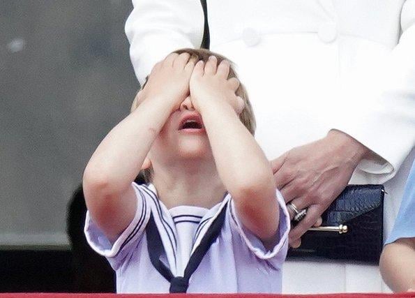 Prince Louis reacts on the balcony of Buckingham Palace, while viewing the Platinum Jubilee flypast, on day one of the Platinum Jubilee celebrations. Picture date: Thursday June 2, 2022.