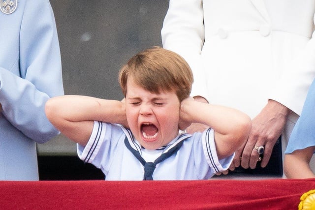 Prince Louis pulls a face on the balcony of Buckingham Palace, to view the Platinum Jubilee flypast, on day one of the Platinum Jubilee celebrations. Picture date: Thursday June 2, 2022.