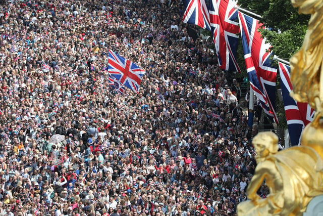 Handout photo issued by the Ministry of Defence of crowds in The Mall around Buckingham Palace in London ahead of the Platinum Jubilee flypast, as the Queen celebrates her official birthday, on day one of the Platinum Jubilee celebrations. Issue date: Thursday June 2, 2022.