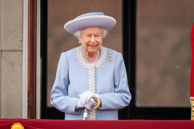 Queen Elizabeth II watching the Royal Procession from the balcony at Buckingham Palace following the Trooping the Colour ceremony in central London, as the Queen celebrates her official birthday, on day one of the Platinum Jubilee celebrations. Picture date: Thursday June 2, 2022.