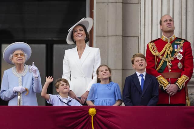 (left to right) Queen Elizabeth II, Prince Louis, the Duchess of Cambridge, Princess Charlotte, Prince George and the Duke of Cambridge on the balcony of Buckingham Palace to view the Platinum Jubilee flypast, as the Queen celebrates her official birthday on day one of the Platinum Jubilee celebrations. Picture date: Thursday June 2, 2022.