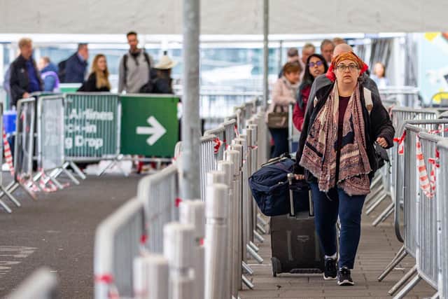 Passengers arrive at Dublin airport on Friday morning as around 200,000 people are set to travel through the airport over the bank holiday weekend
