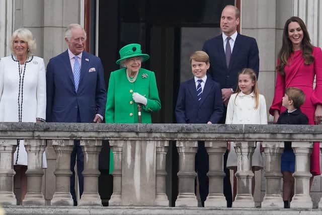 The Queen appears on the balcony of Buckingham Palace at the end of the Platinum Jubilee Pageant with, from left, the Duchess of Cornwall, the Prince of Wales, Prince George, the Duke of Cambridge, Princess Charlotte, Prince Louis, and the Duchess of Cambridge . Photo: Jonathan Brady/PA Wire