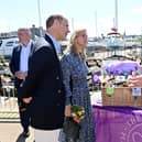 The Earl and Countess of Wessex talk to the NIO minister Conor Burns MP, beside a hamper of Northern Ireland produce, on the pier in Bangor on Saturday. In the background is the marina and a temporary ferris wheel. The royal visitors were cheered by a large crowd on their visit to the seaside city. Jubilee celebrations here follow another big event, when people finally got to mark NI’s centenary.. 
Photo by Stephen Hamilton / Press Eye
