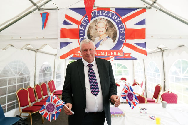 A man attends a picnic at St. Bartholomew's Parish Church, Newry, as part of the Big Jubilee Lunch as celebrations continue across Northern Ireland for the Queen's Platinum Jubilee. Picture date: Sunday June 5, 2022.