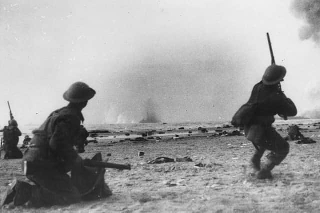 British soldiers fire at low flying German aircraft at Dunkirk