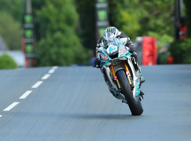 Michael Dunlop won Monday's opening Supersport race on his MD Racing Yamaha and set a new lap record at 129.45mph.