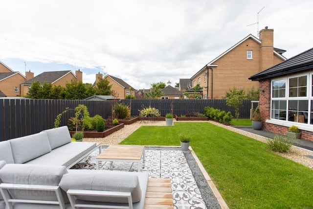 The well-kept garden area is designed for low maintenance.