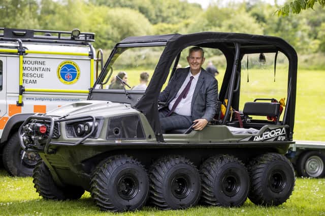 Edwin Poots MLA sitting in the new amphibious rescue vehicle