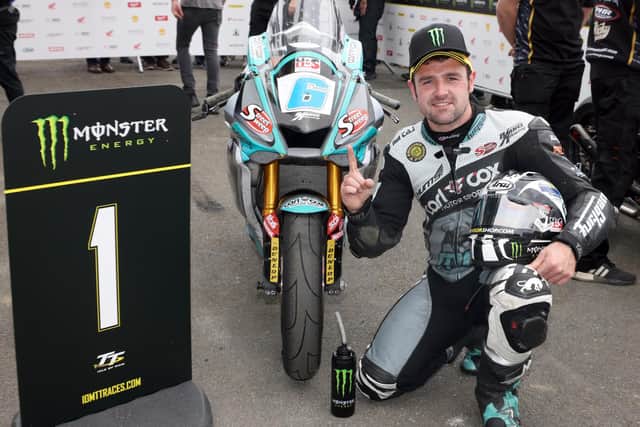 Michael Dunlop celebrates his 20th Isle of Man TT victory in Monday's Supersport race.