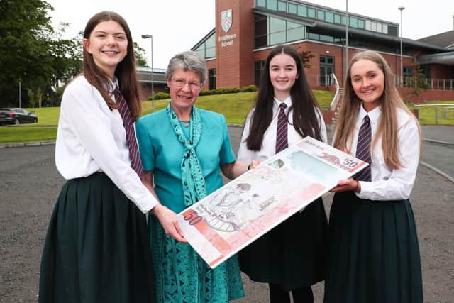 Dame Jocelyn Bell Burnell paid a surprise visit to Strathearn School where she met year 13 pupils (L-R) Jess Ryan, Rosie Hardy and Rebekah Devlin. During the visit, Dame Jocelyn showcased the new Ulster Bank £50 note which features her iconic pulsar discovery and women working in NI's burgeoning life sciences industry.