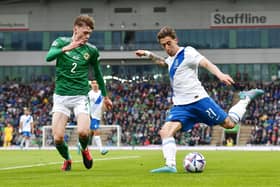 Conor Bradley in action against his Liverpool teammate Kostas Tsimikas when Northern Ireland took on Greece last week